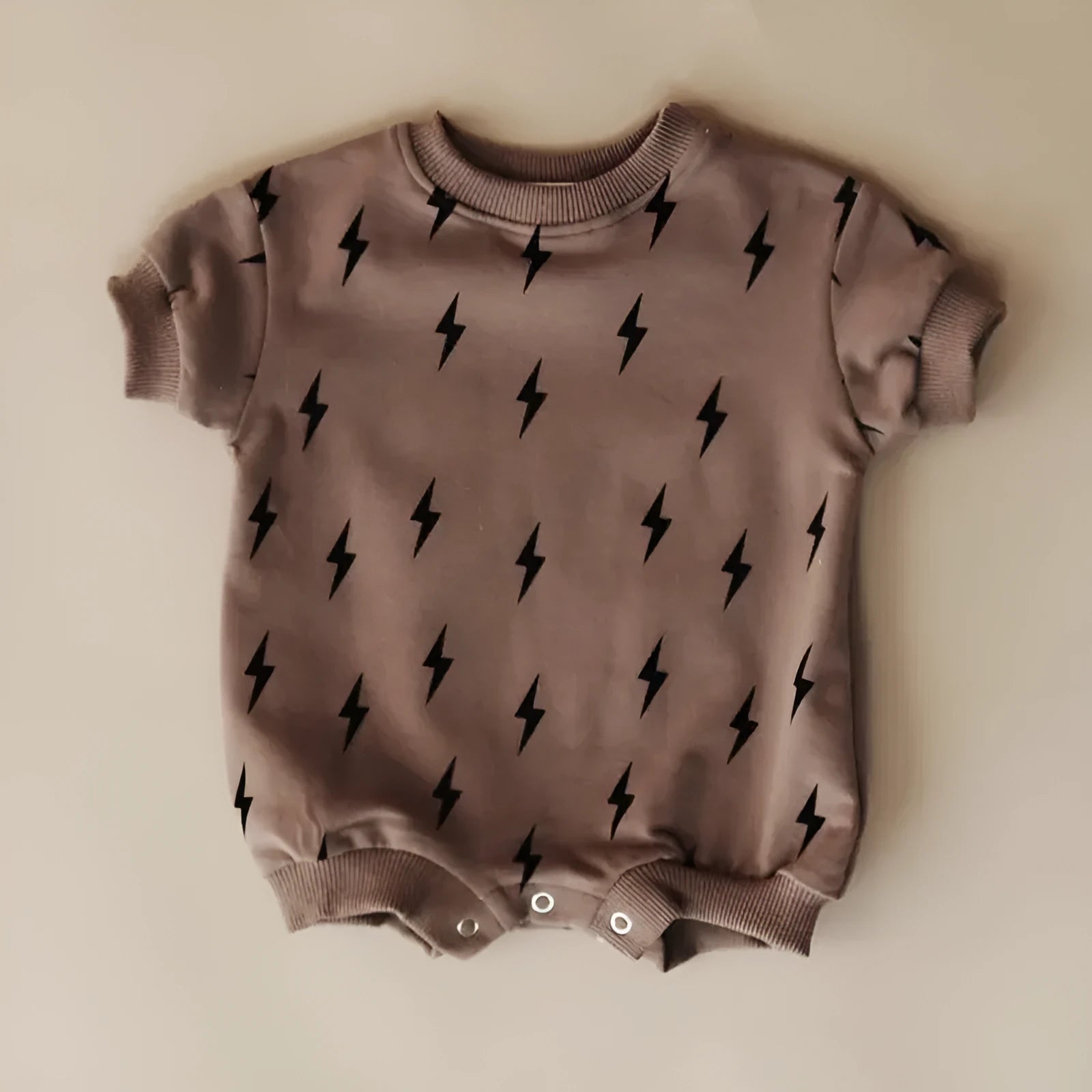 Printed triangle baby romper in cotton wool pull frame fabric with long sleeves and ribbed hem