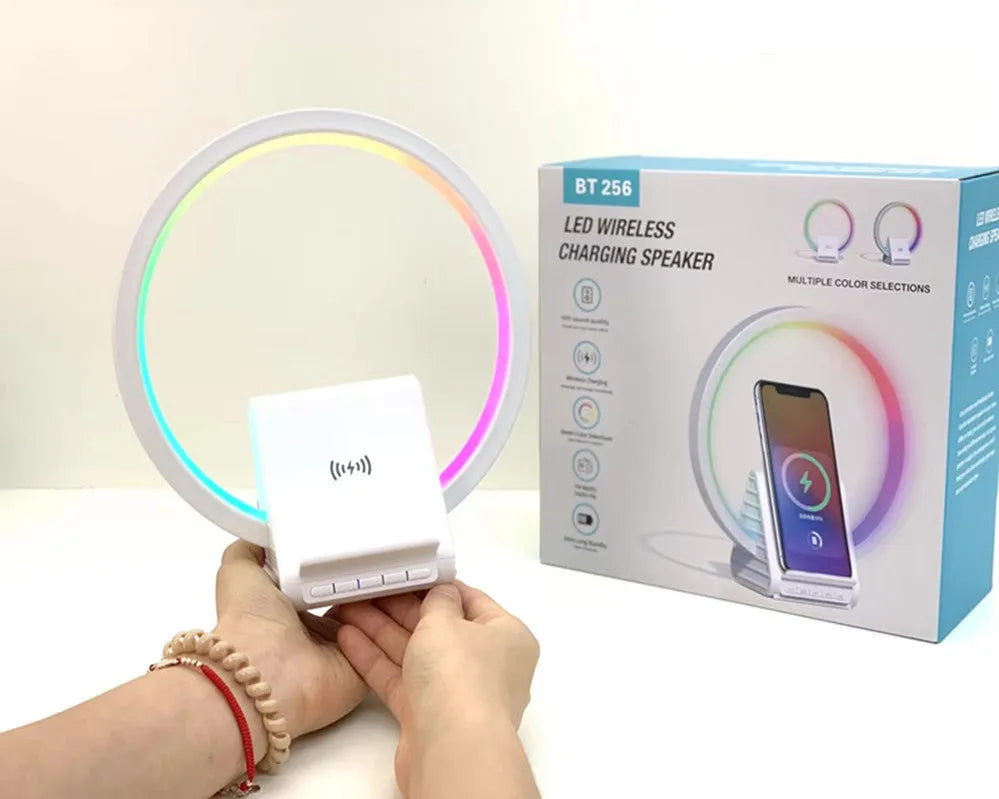 White smart Bluetooth speaker with wireless charging pad and ambient light ring