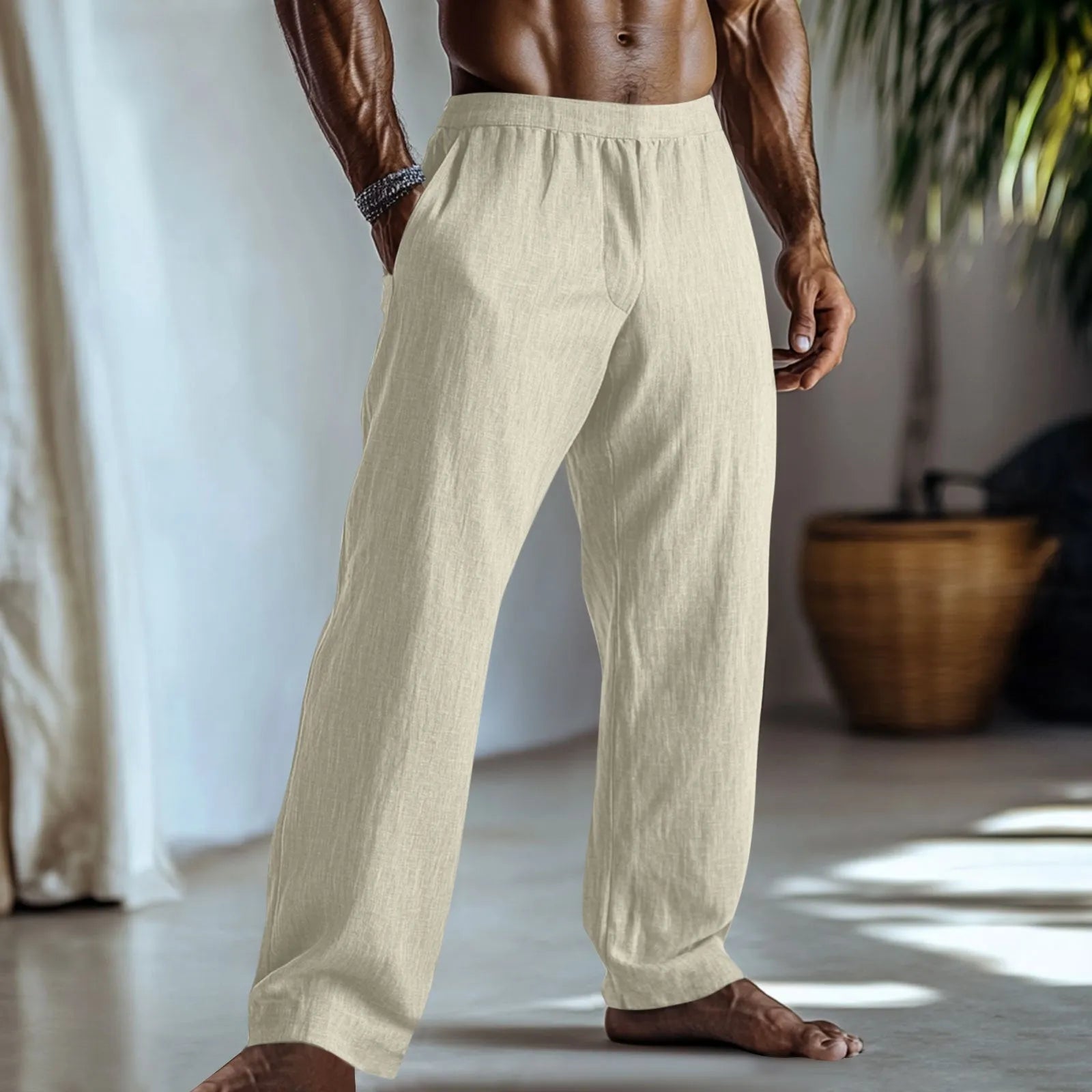 Straight-leg cotton linen trousers in light green on a hanger