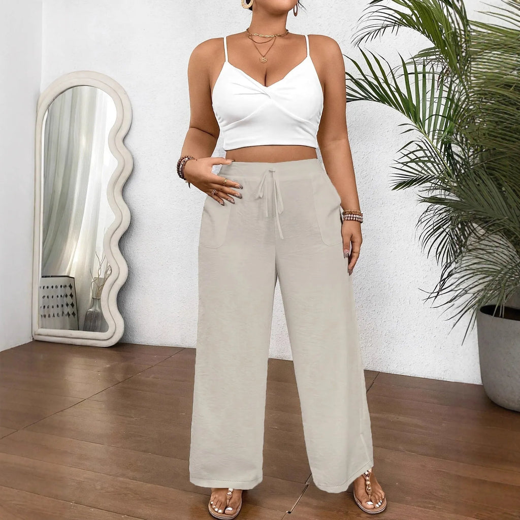Drawstring wide leg loose fit women trousers in khaki colour with side pockets and drawstring waist.
