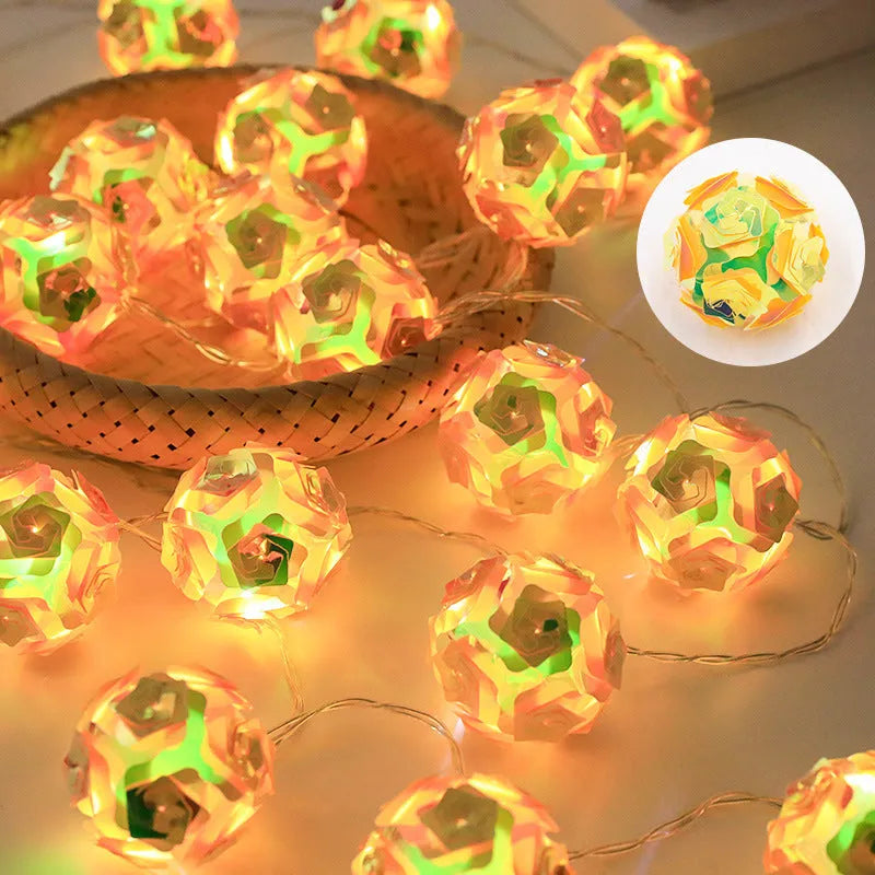 Laser rose windmill LED lamp string with crystal orange light colour on a dark background showing 5cm beads