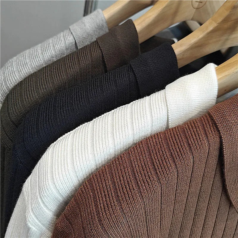 Man wearing a loose striped lapel knitted sweater in light grey, showing rabbit fur and modal blend fabric.