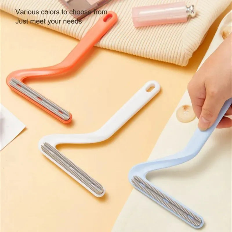 Double-sided pet hair removal comb in blue for removing cat and dog fur from beds and upholstery