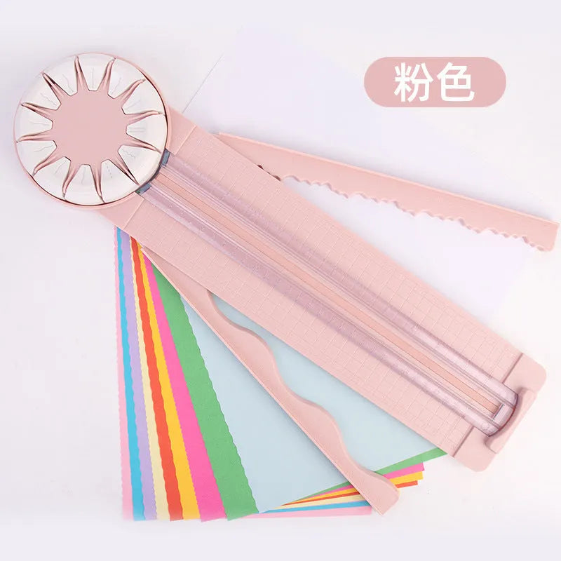 Pink 12-in-1 multifunctional paper cutting machine with dotted guide lines on its base.