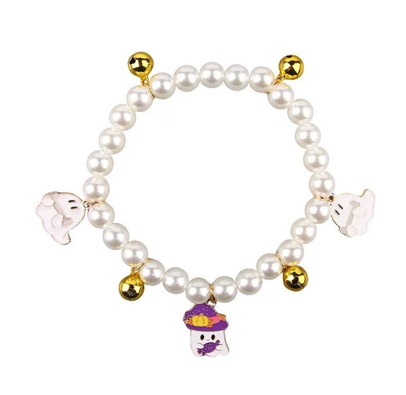 Decorative Halloween cat collar with simulated pearls and pumpkin charm in purple ghost design