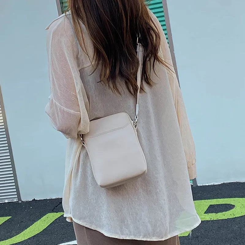 Simple solid colour mobile phone crossbody bag in PU leather showing black, beige, khaki, and green colour options.