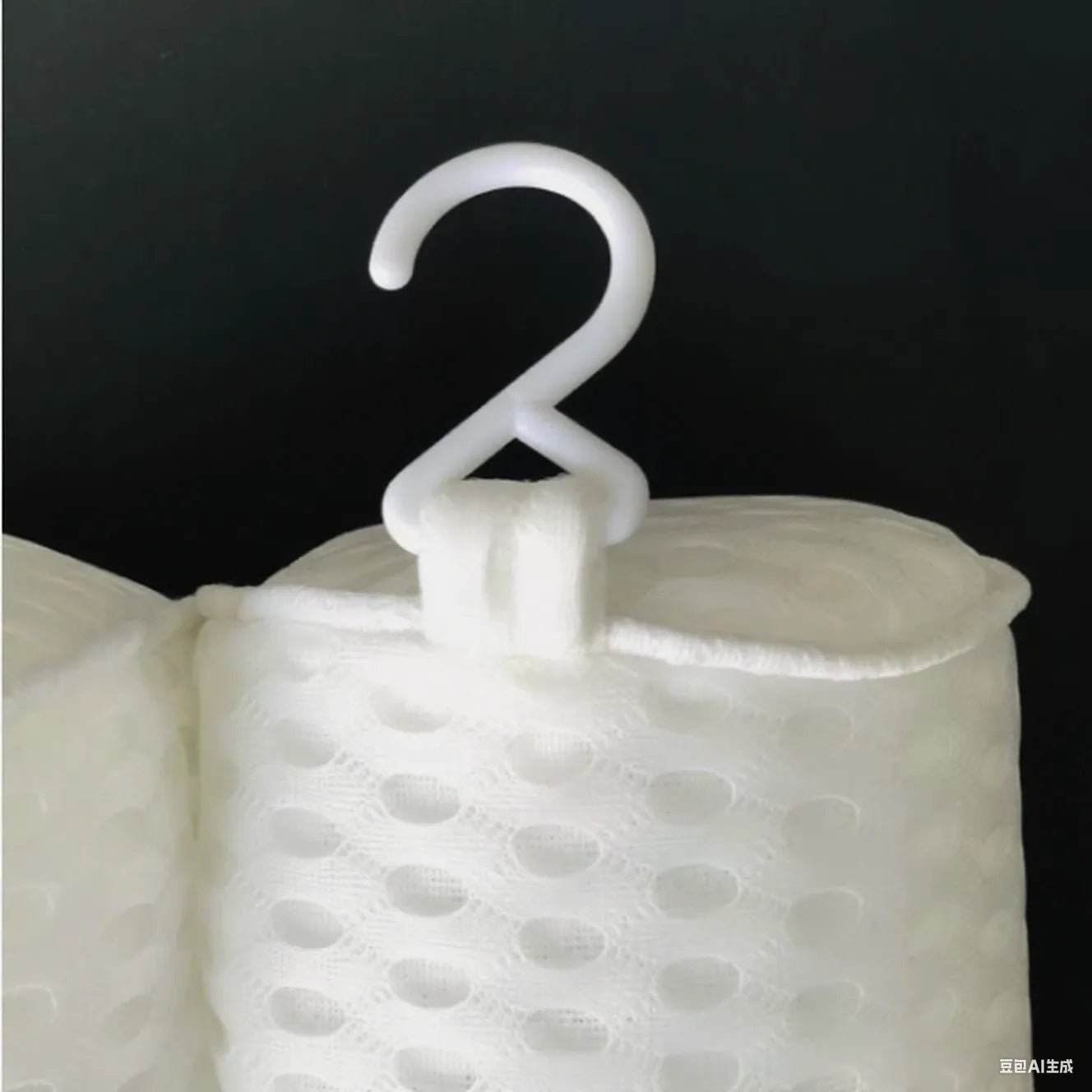White bathtub pillow with mesh fabric and seven large suction cups on the back.