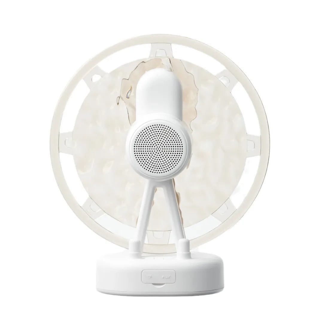 White Ferris wheel Bluetooth speaker with colourful atmospheric lighting effects on display