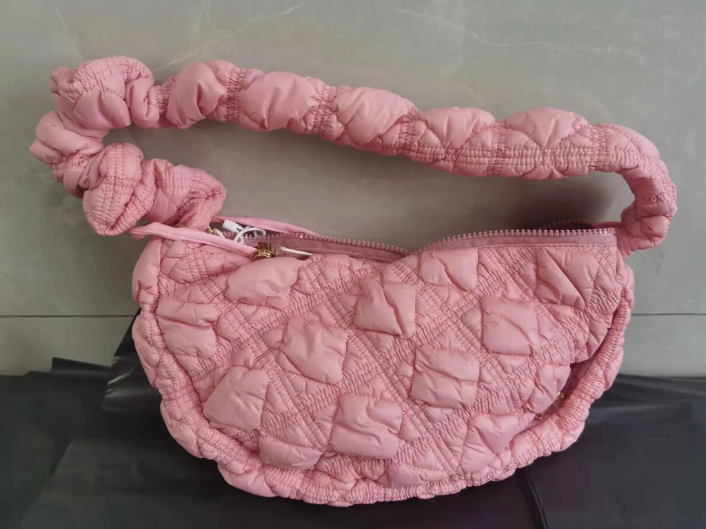 Light beige women's casual nylon shoulder messenger bag with a long adjustable strap.