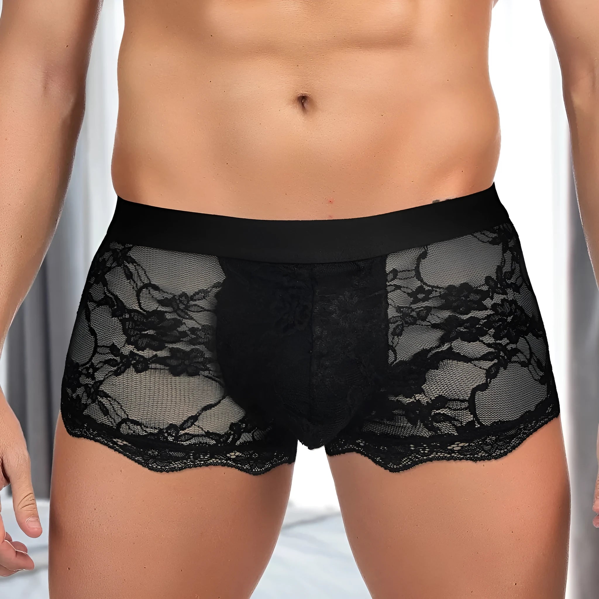 Men's black lace briefs with hollow-out see-through design on mannequin