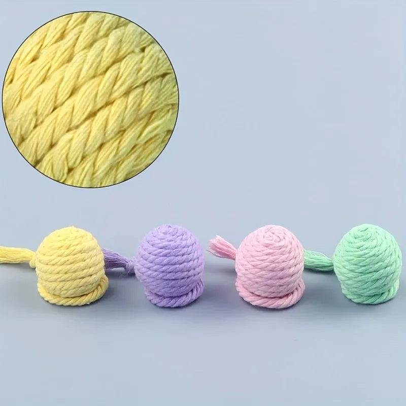 Cat toy ball with rope attached in green, pink, purple or yellow colour with internal bell