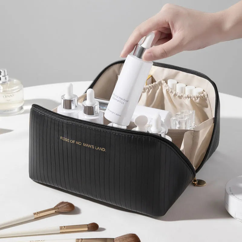 Vertical pattern pillow makeup bag in a cubic shape with large capacity for travel storage.