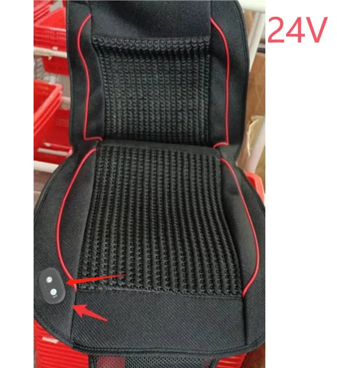 Black car ventilation seat cushion with power cord on car seat measuring 60 by 60 centimetres