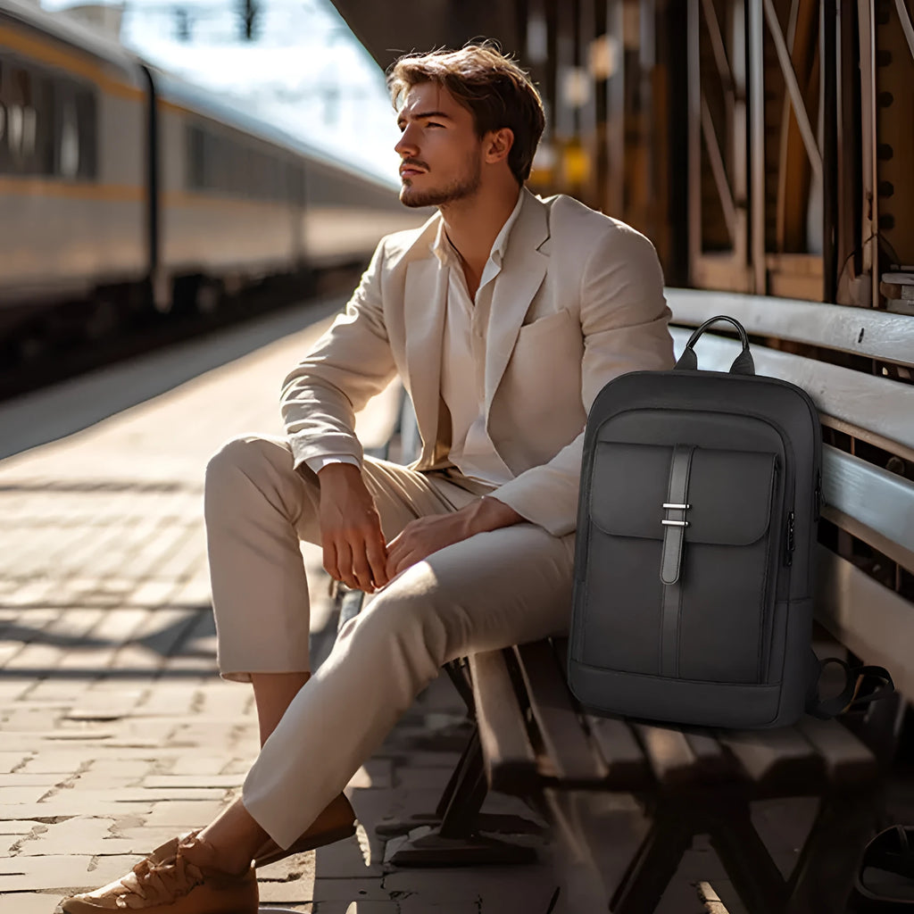 Black Oxford cloth backpack with visible stitching, shown on a neutral background