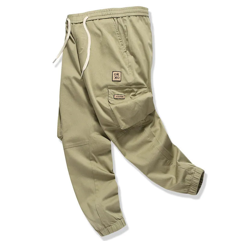 Men's multi bag pants in black, loose fit with multiple pockets, 80% polyester casual trousers