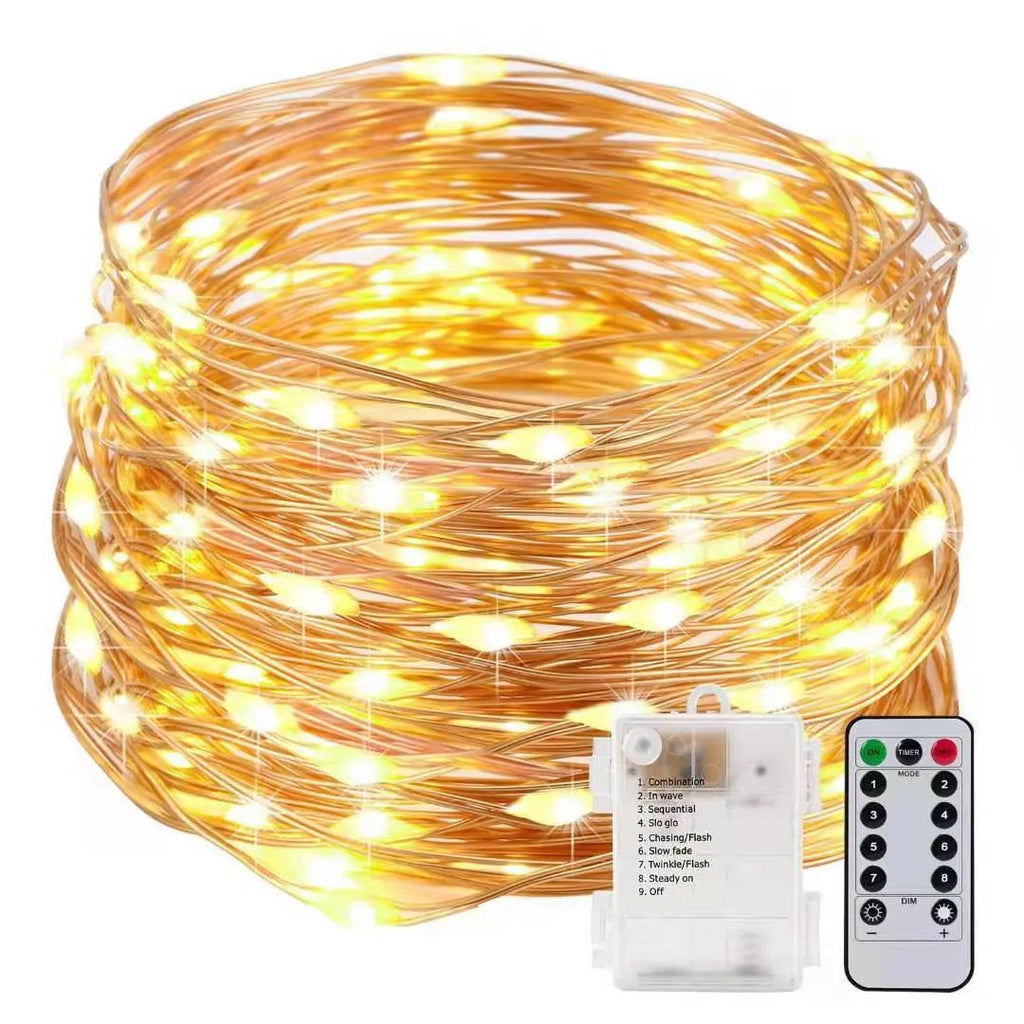 Flexible copper wire string light with 120 LEDs wrapped around a branch, showing battery box and USB connection.