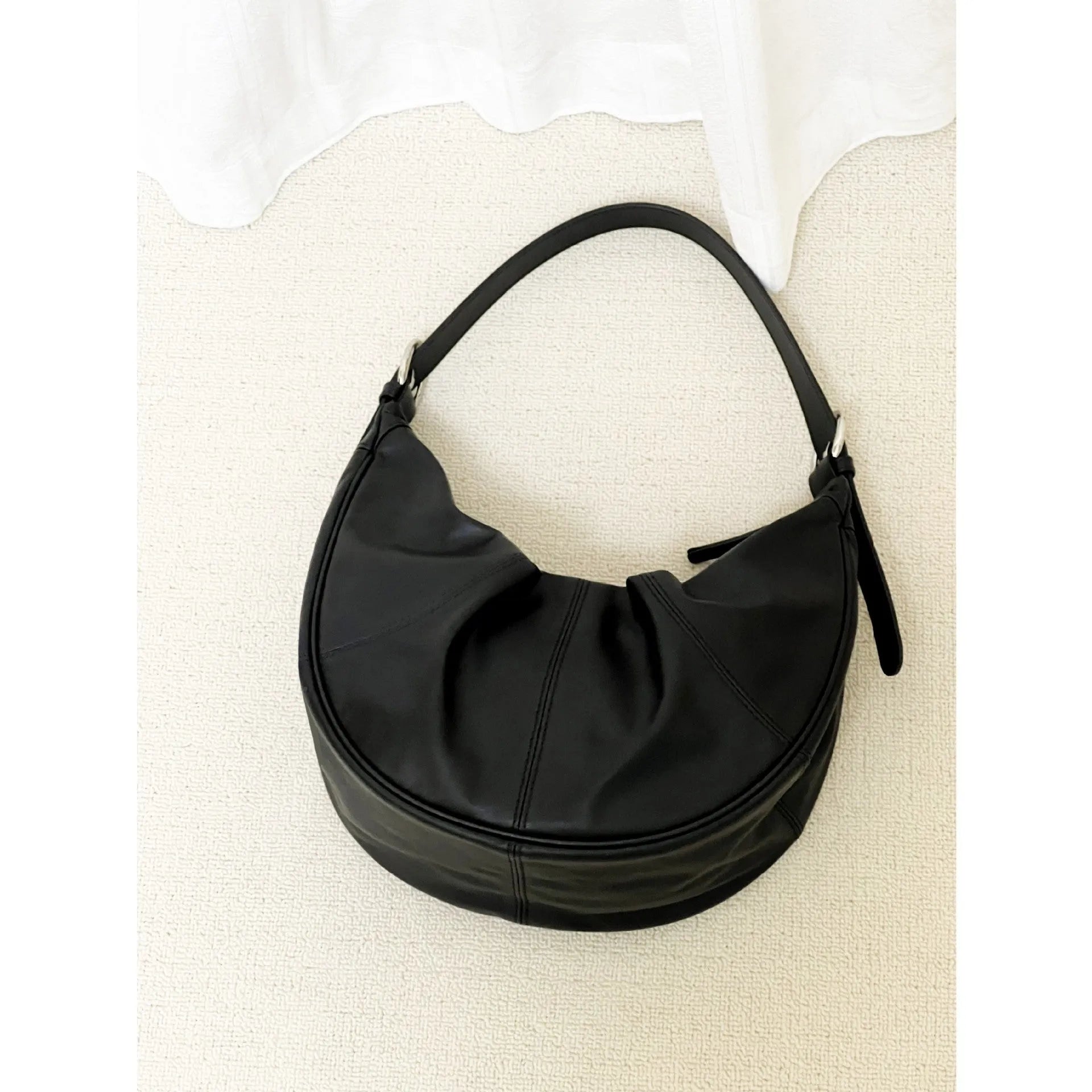 Women's black dumpling-shaped cowhide leather shoulder bag with double strap