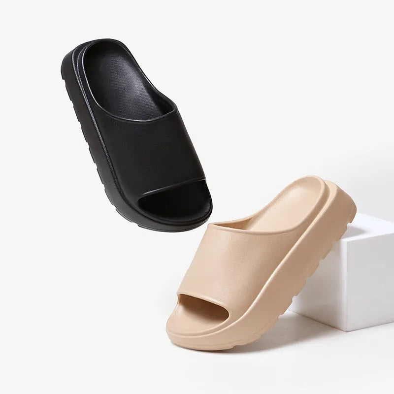 Women's thick-soled beach slippers in beige with a textured EVA sole.