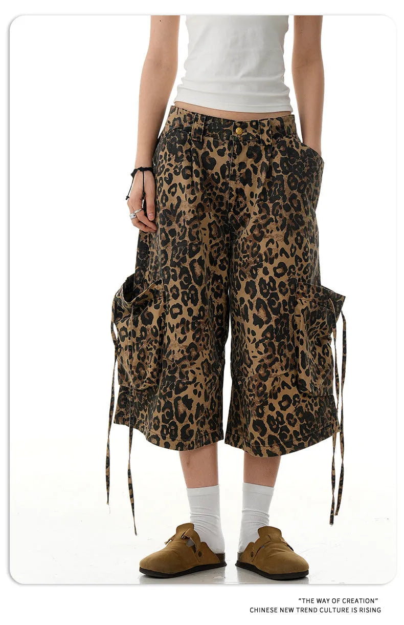 Women's high-waisted leopard print cropped trousers with a loose straight leg and button fly.