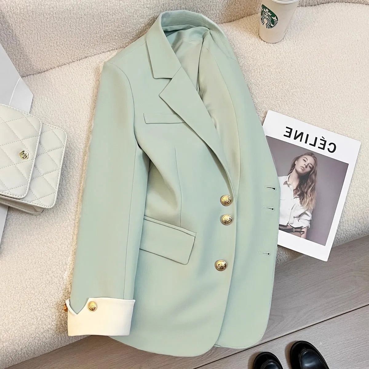 Korean style loose fit women's coat in milky white, showing medium length and pocket details.