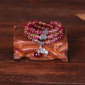 Handcrafted watermelon crystal bracelet with Chinese knot design showing 8mm elephant-style beads