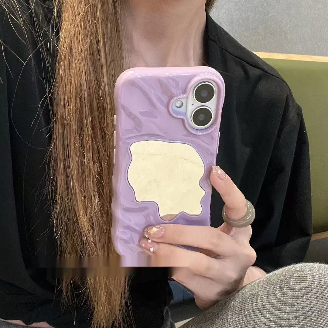 Water ripple texture solid colour mirror phone case for iPhone on a table.