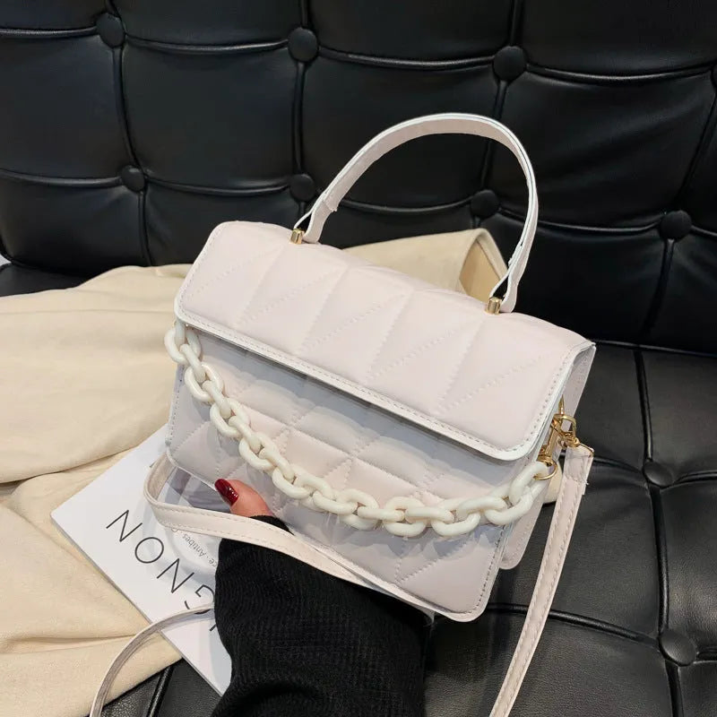 Casual small square PU shoulder messenger bag in black on a white background