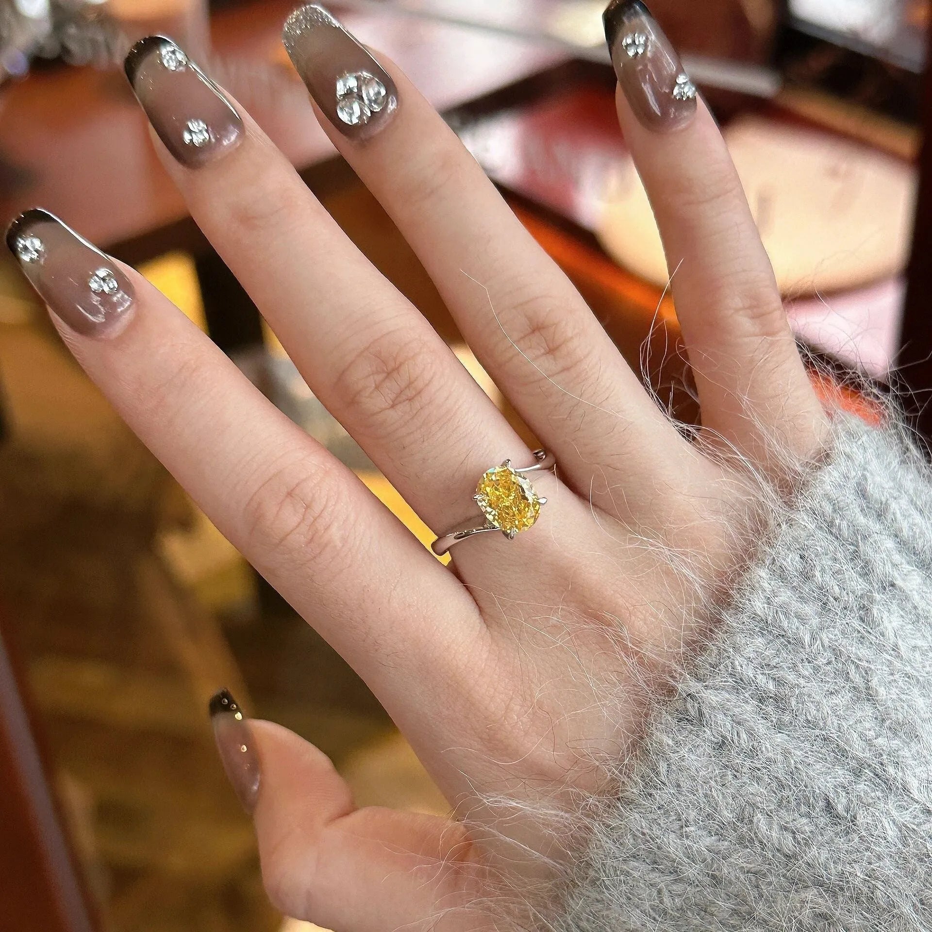 Yellow rock sugar crystal women's ring in polished copper on a hand