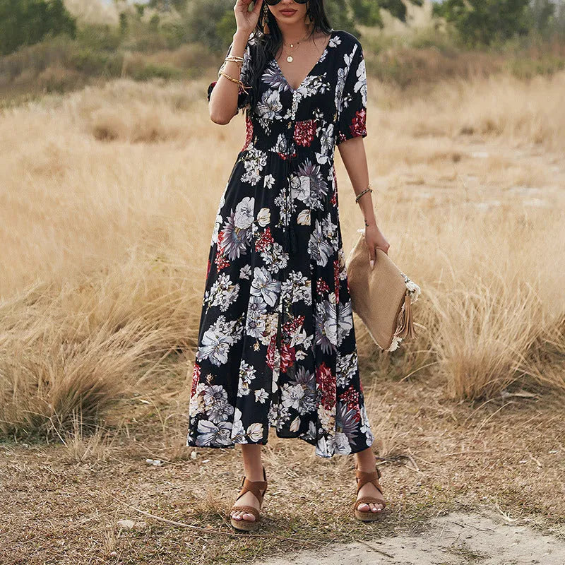 Women's floral summer dress with V neck, short sleeves, elastic waist and large hemline mid-length skirt