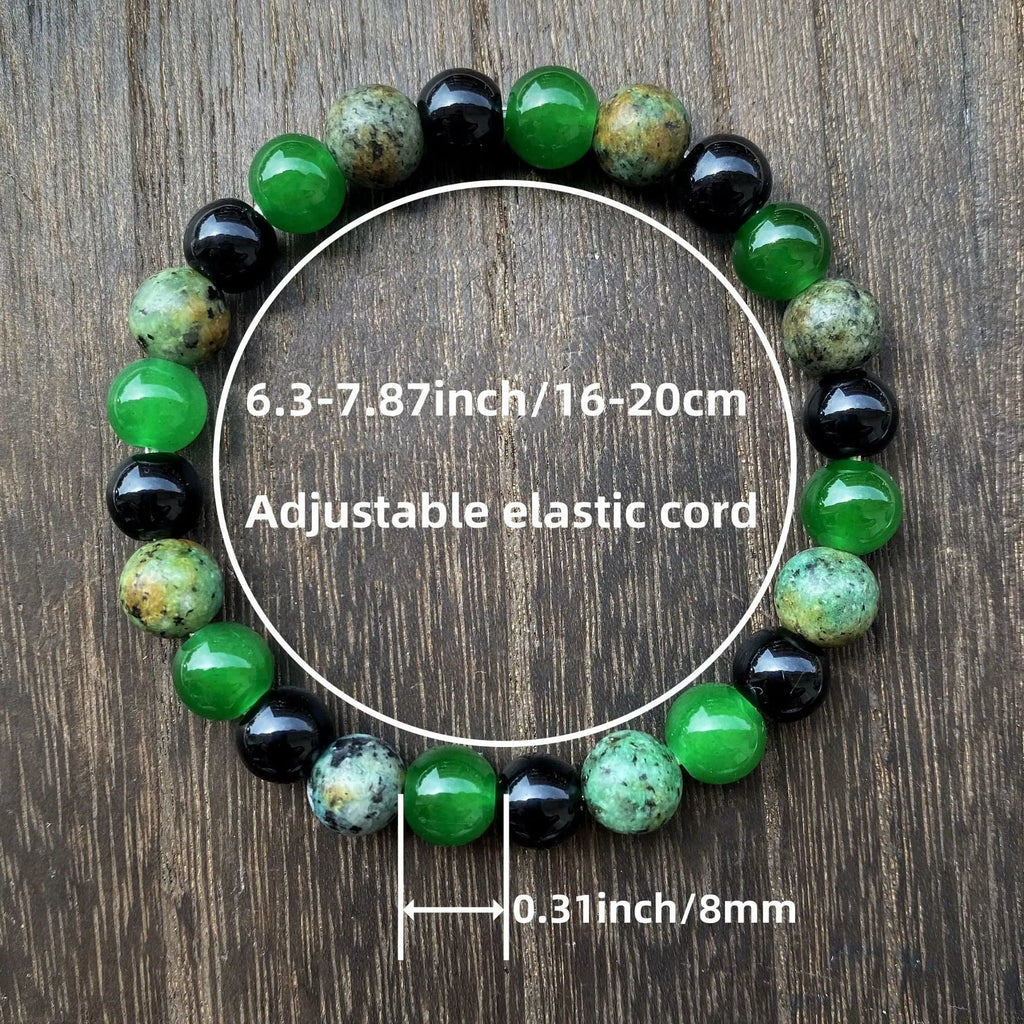 Men's casual green onyx obsidian crystal bracelet with 8mm handmade beads on a light background
