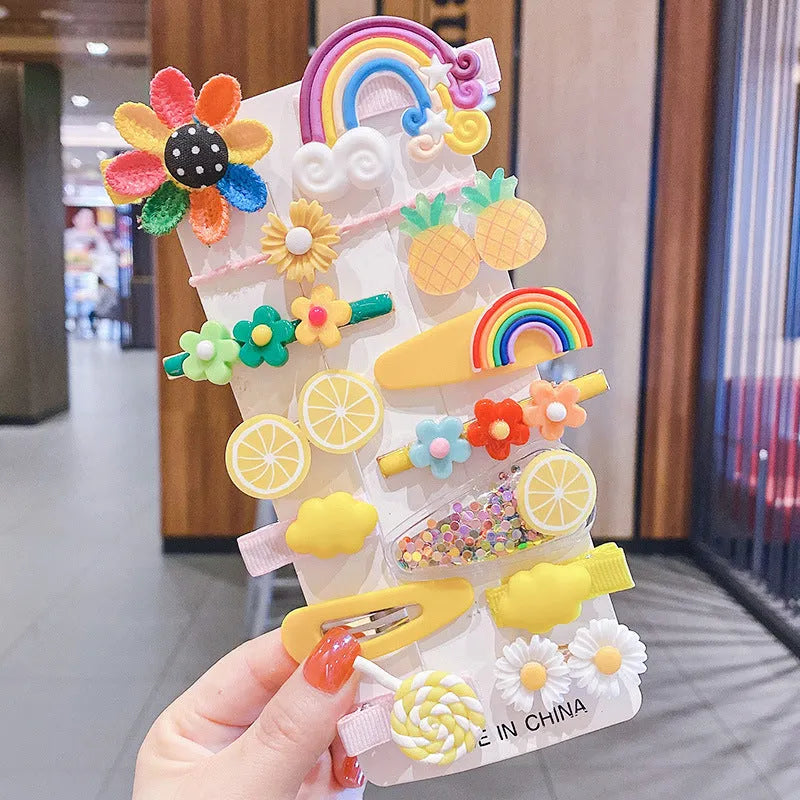 14-piece toddler hair clips set with rainbow barrettes, candy fruit, butterfly, and ice cream patterns on white background