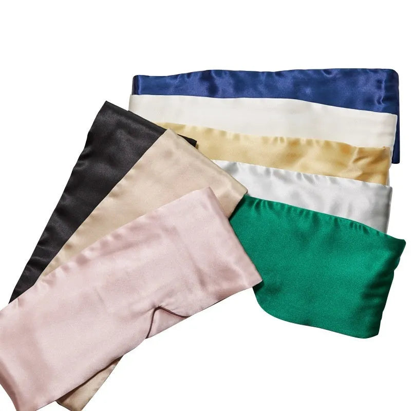 Mulberry silk sleep eye mask shown in various colours including black, champagne gold, and navy blue
