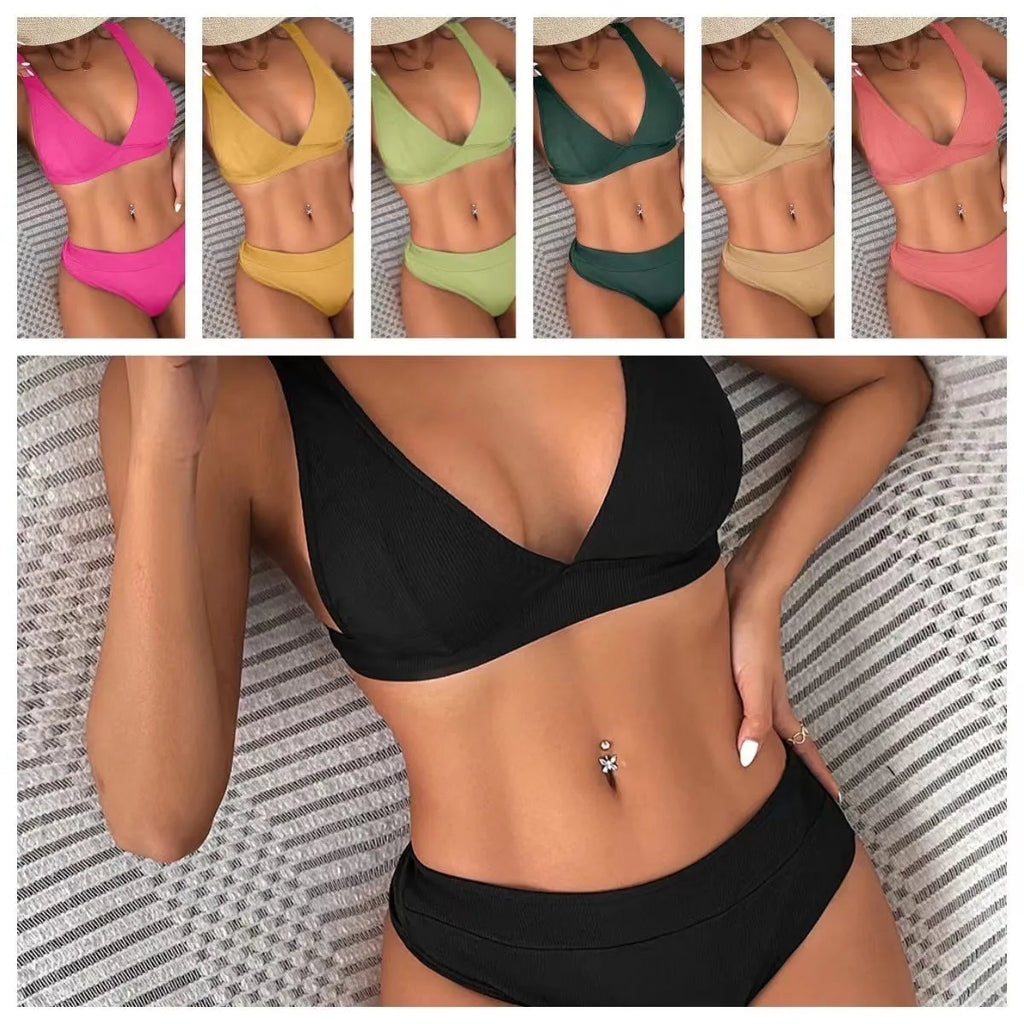 Women's black ribbed lace-up split bikini swimsuit laid flat, showing front design detail.