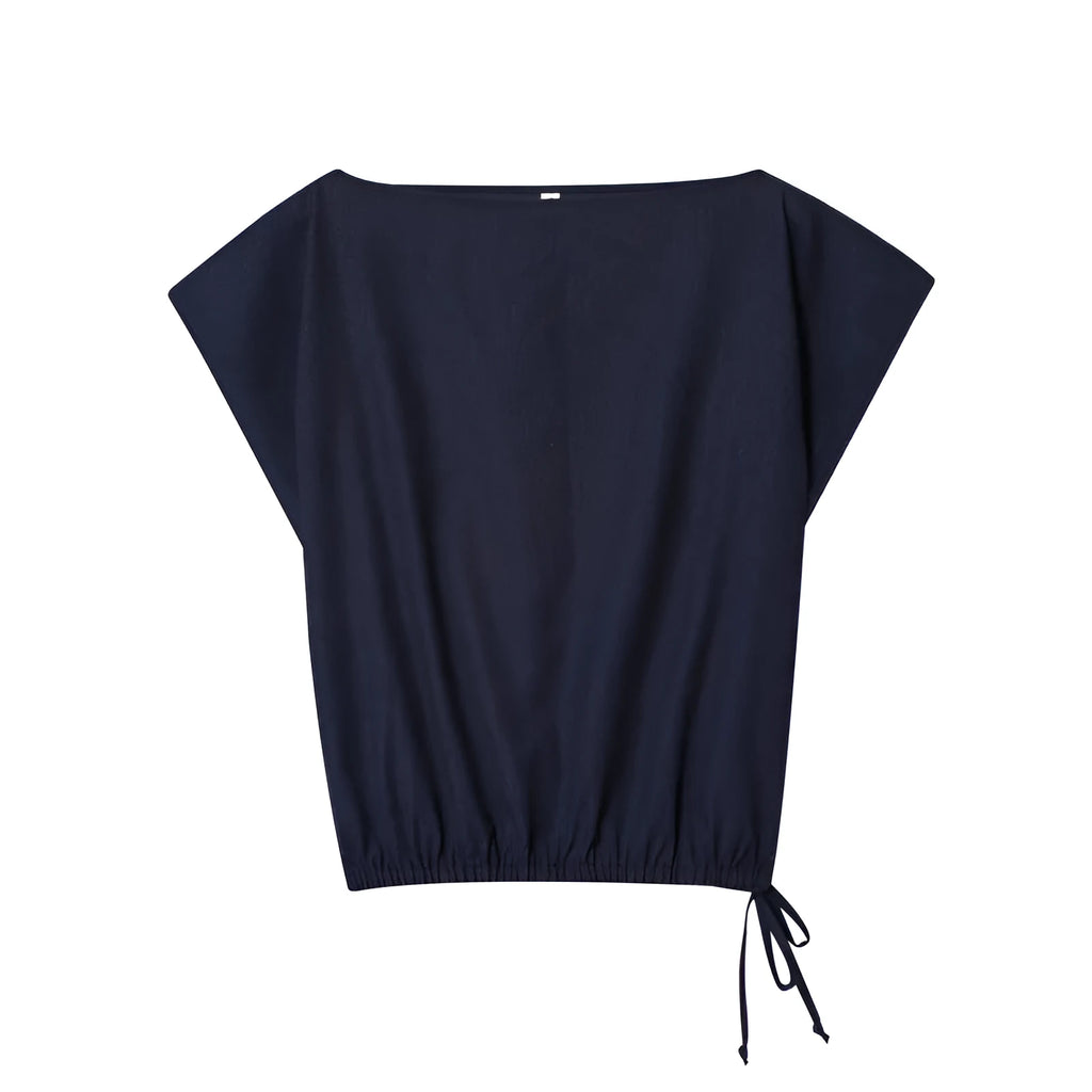 Women's linen blend wide-leg trouser and flounced sleeve top co-ord suit set in a professional style.