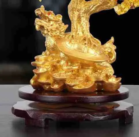 Citrine resin turtle money tree Feng Shui ornament on a white background.