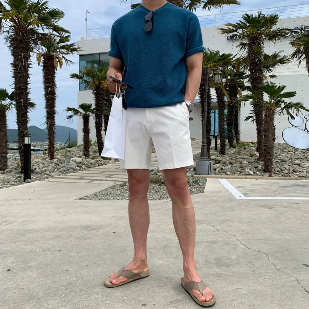 Men's straight-leg casual shorts in solid black, shown laid flat, featuring a non-iron polyester fabric.