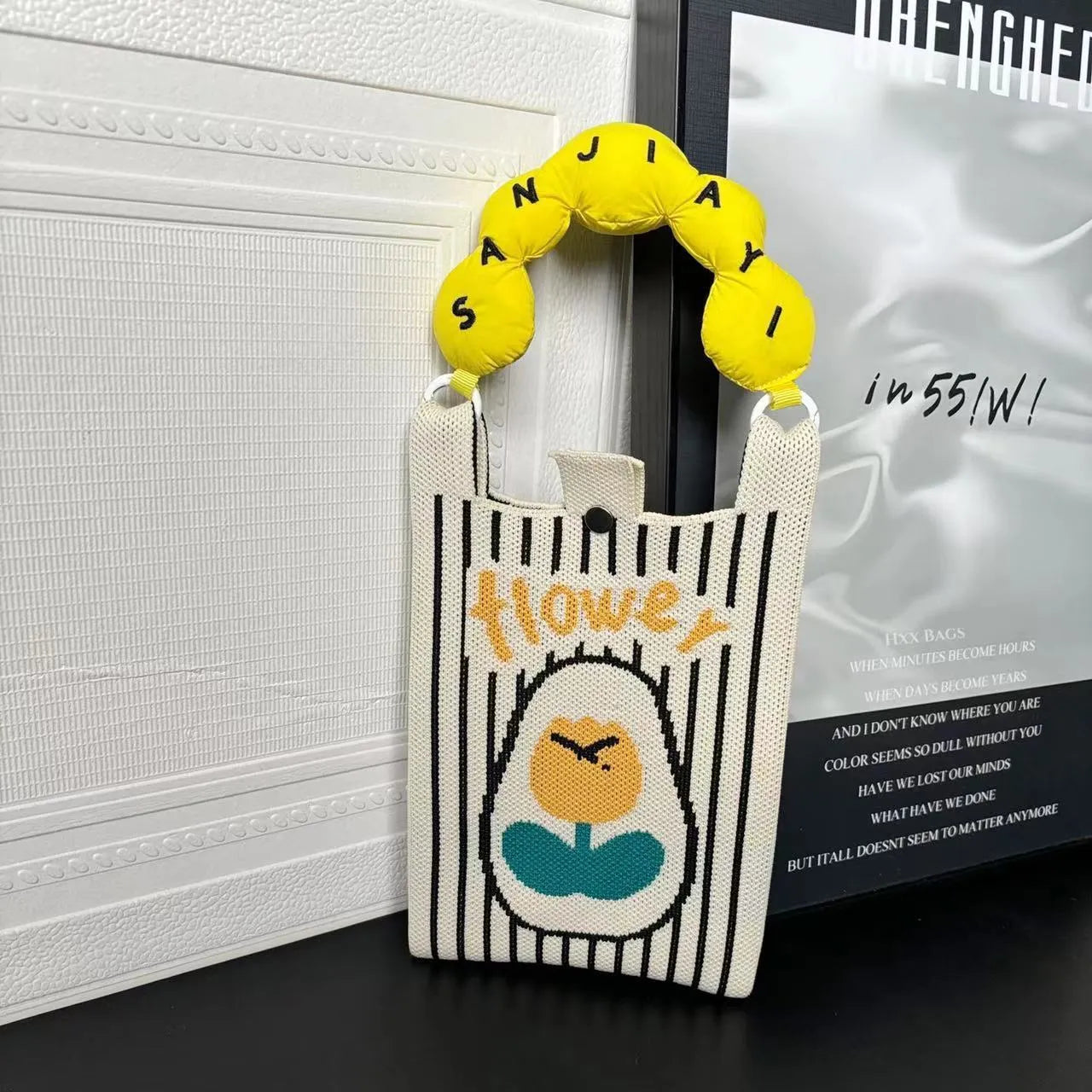 Cartoon knitted messenger bag with woven design and single shoulder strap