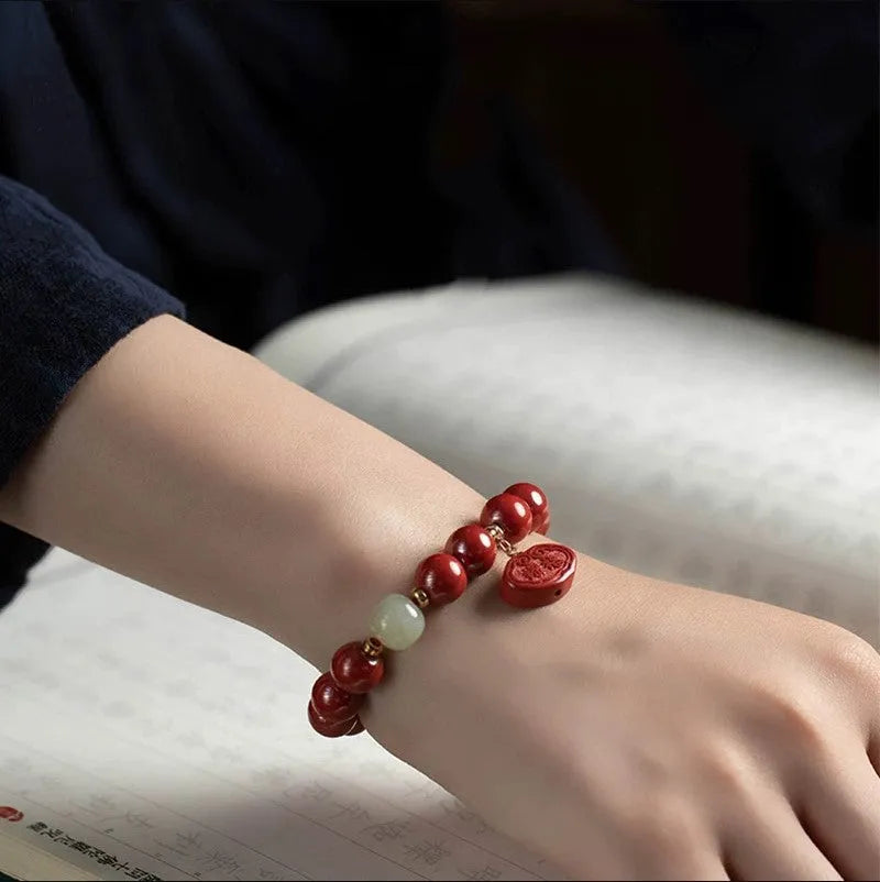 Natural cinnabar Emperor Sandstone bracelet with Ping An Fu Lu design in 8mm or 10mm bead size