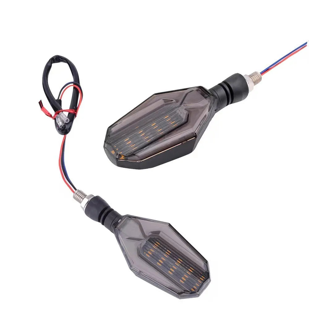 Pair of motorcycle LED indicator lights with coloured light guide options on black background