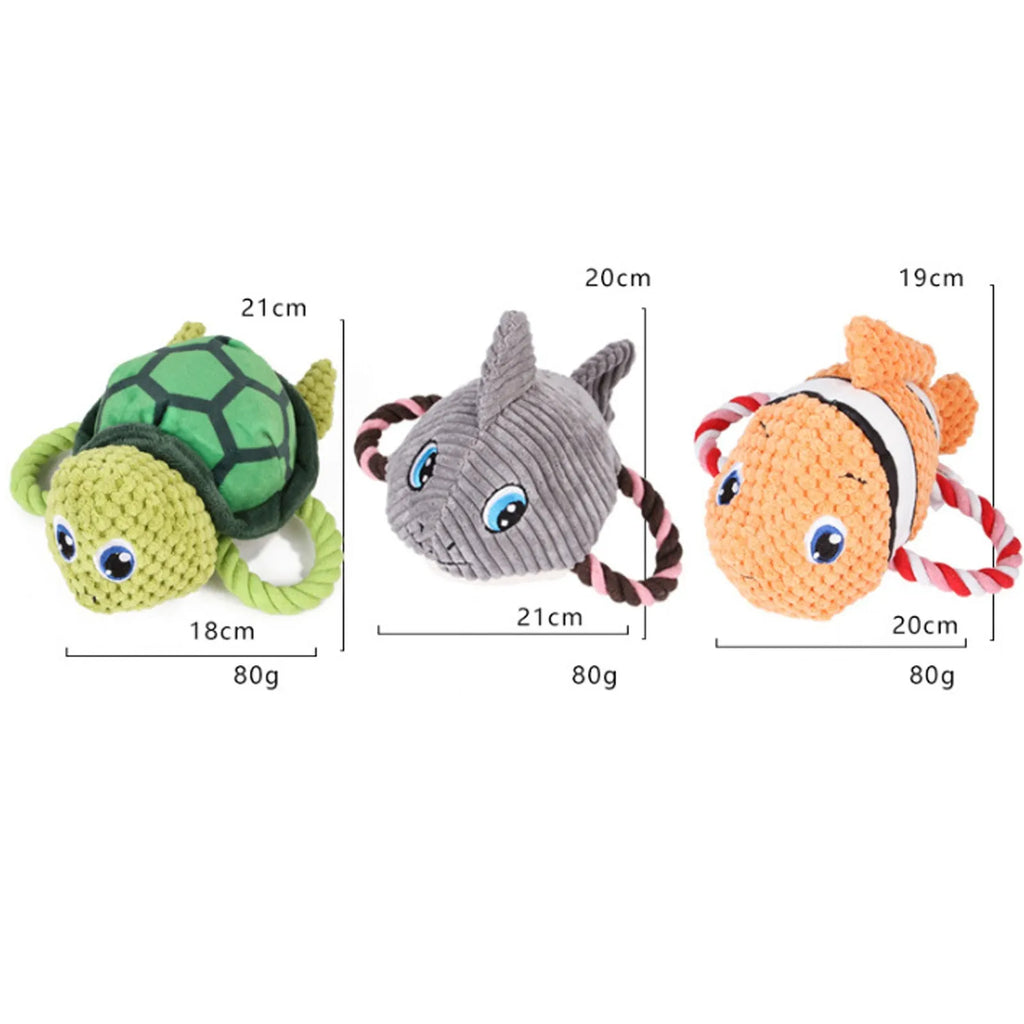 Grey turtle-shaped stuffed dog toy with a visible rope knot centre for chewing.