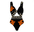 Women's black one-piece swimsuit made from polyester fabric for beach and pool use.