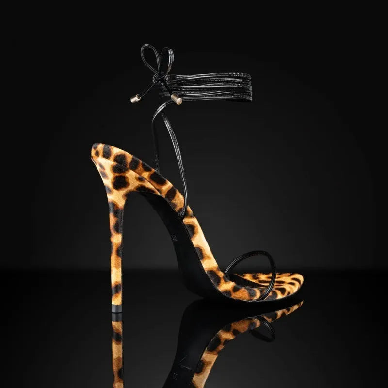 Women's leopard print Roman sandals with pointed toe and buckle fastening on a rubber sole.