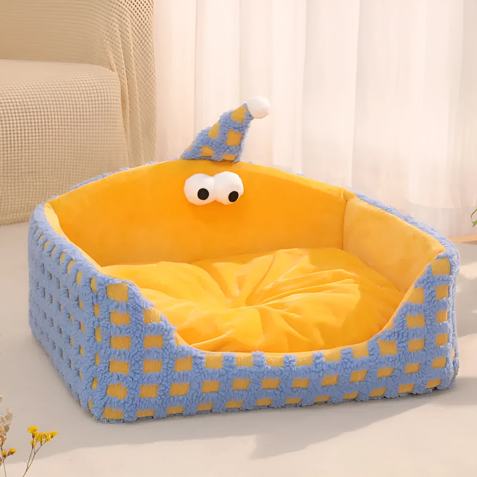 Green triangular pet sleeping nest with removable cover for cats and small dogs.