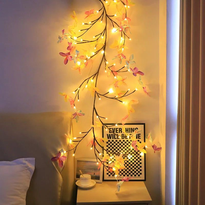 Flexible LED butterfly tree rattan lamp shaped into a decorative spiral, showing USB cable and lit white LEDs.