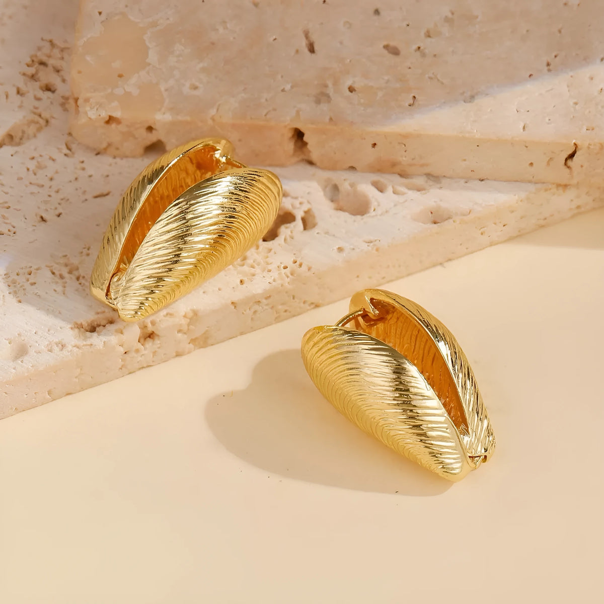 Gold geometric shell thread clip-on earrings on woman, beach ocean vacation style, zinc alloy electroplated ear clips