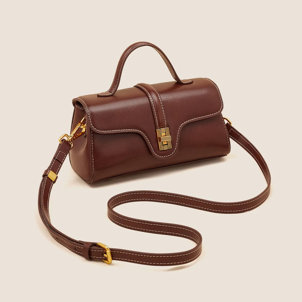Niche retro Cambridge messenger bag in brown cow leather with lock detail and clamshell opening