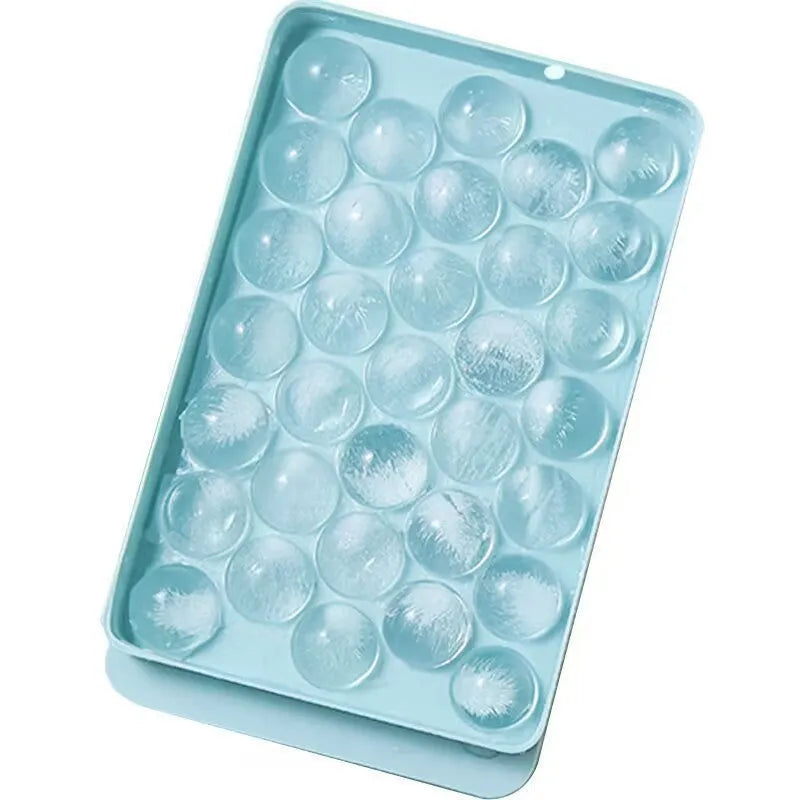 Blue silicone ice cube tray with lid showing 33 round moulds