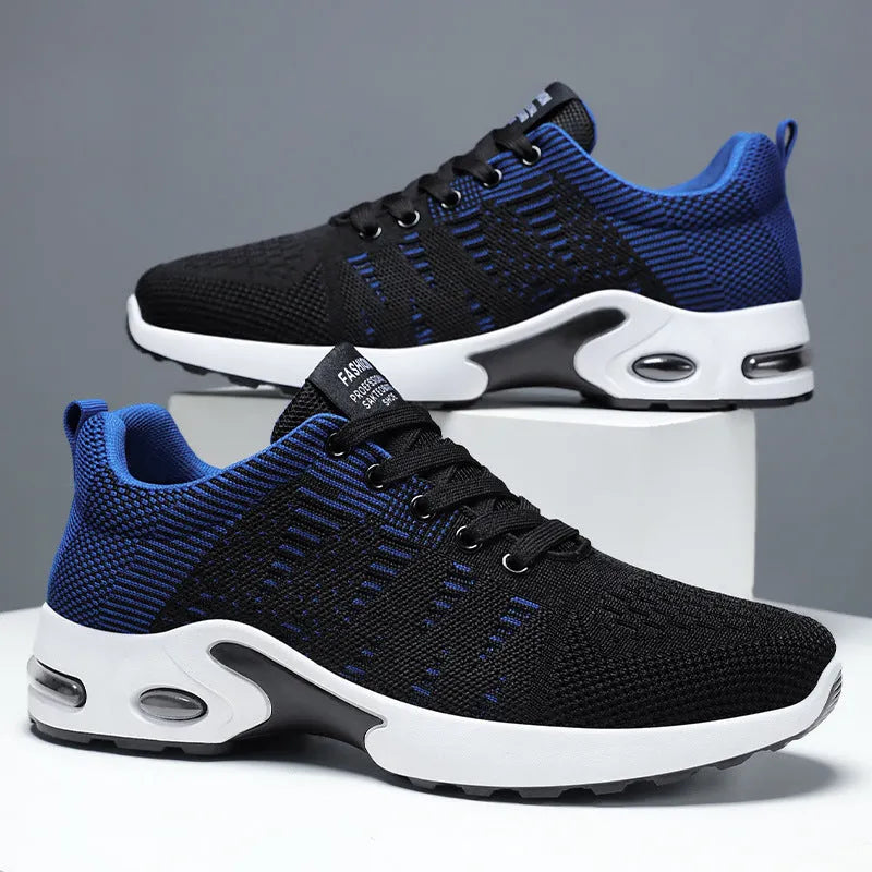 Men's low-top black and gray Flyknit mesh casual sneakers with lace-up front and round toe.