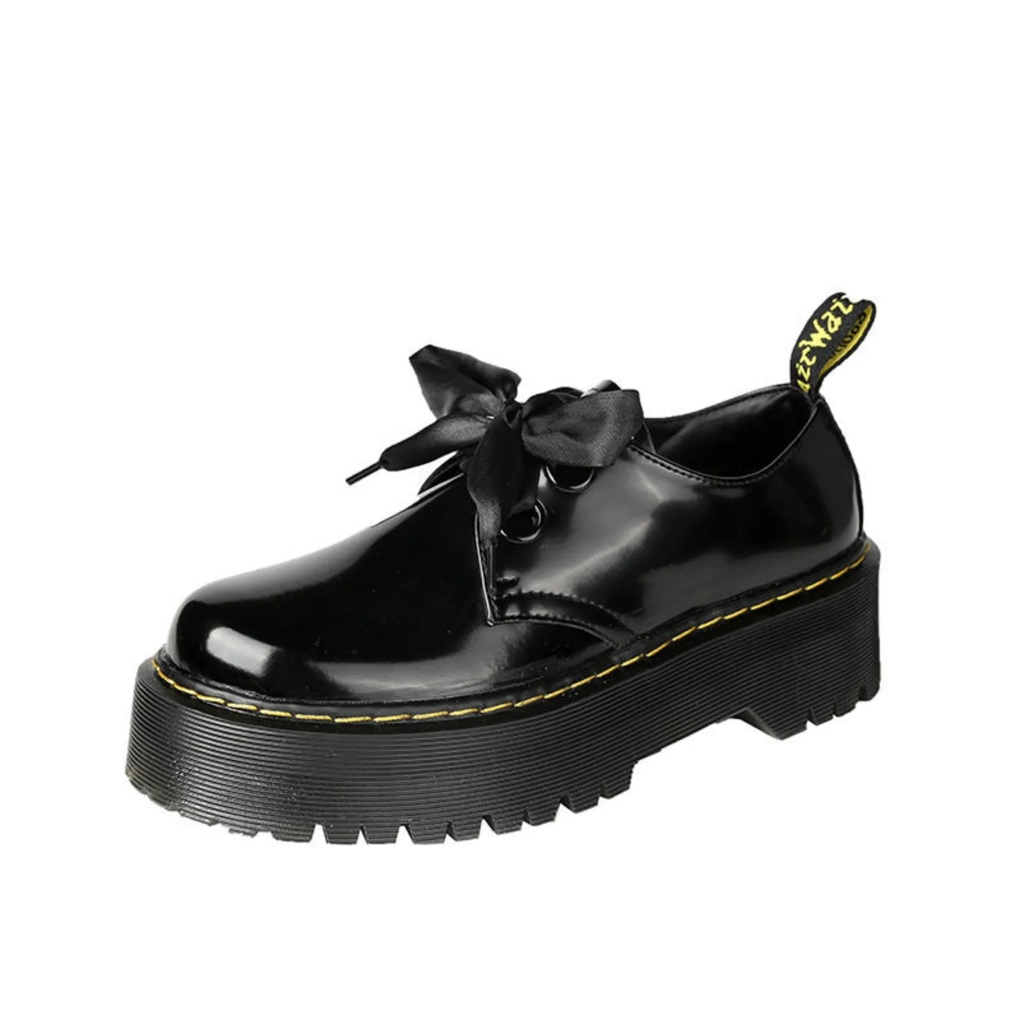 Women's black leather shoes with a thick sole, cross strap, and lace-up closure.
