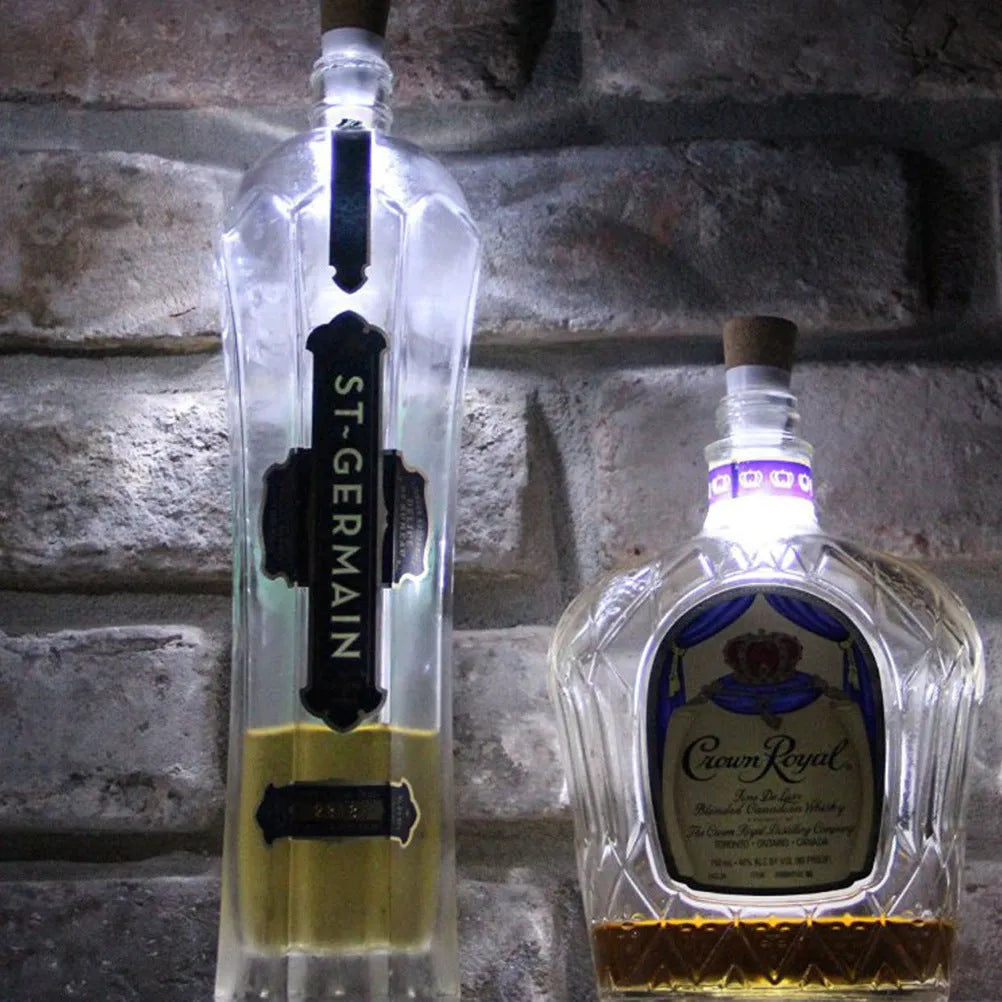 White plastic rechargeable LED bottle cap light with 15 beads, shown on a wine bottle for holiday decor.
